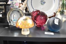 A quantity of four 20th-century studio glass paperweights, including a Caithness Dolphin and a