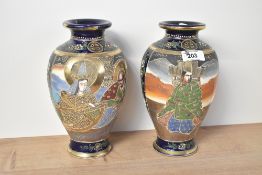 A pair of 20th-century Japanese Satsuma ware vases, featuring foliate and floral decoration with