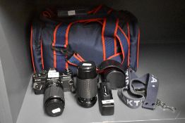 A Praktica B100 Electronic camera with Prakticar PB 1:4,5-5,6 80-200mm lens, a Praktica Auto Zoom