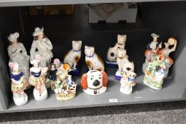 A large quantity of 19th century Staffordshire pottery, to include large flat-backs of English