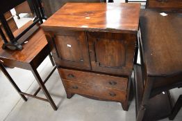 A 19th century figured mahogany cupboard/chest, the rectangular top with reeded edge detail over two