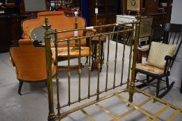 A Victorian brass and iron four foot bed frame, with typical brass rails to head and foot boards,