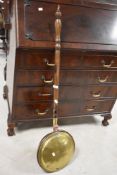 A 19th century copper and brass warming pan, with turned handle 114cm