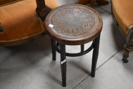 A bentwood bistro stool, of typical circular form 43cm x 32cm