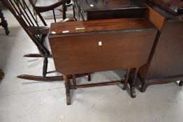 An early 20th century mahogany Sutherland type table, with canted rectangular flaps and turned