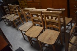 A set of six chapel chairs, of traditional design with book trough to back, seat height 45cm