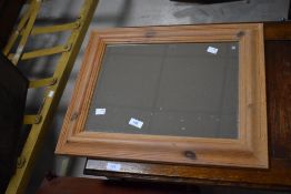 A small decorative pine framed mirror 43cm x 53cm