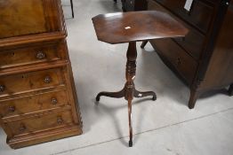 A 19th century mahogany stem table, the canted and reeded rectangular top above the turned central