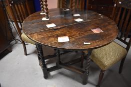 A period oak table having twist gateleg , approx width 107cm, closed depth 43cm