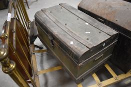An antique green and black painted tin trunk, of typical design