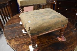 Two 19th century mahogany stools, each with padded rectangular 'seats' and moulded seat rails over