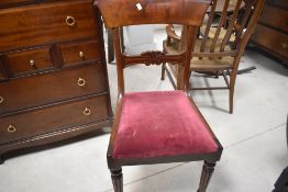 A 20th century oak gate legged table, of traditional form with demi-lune flaps, and gated block