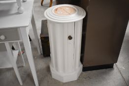 A late painted Victorian marble topped pot cupboard, of fluted cylindrical form, late white