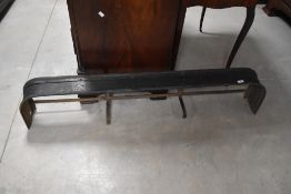 A steel fire fender, of traditional design with rounded corners 130cm some corrosion