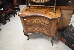 A 19th century Continental inlaid mahogany commode chest, of rectangular form with concaved front,