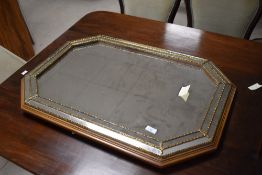 A vintage cushioned mirror, approx width 83cm