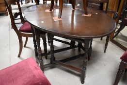An 20th century mahogany swing dressing mirror, the rectangular plate pivoted between and over