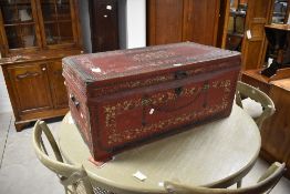 An attractive late 19th century Chinese export red stained, hand decorated, brass studded leather