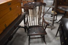A 20th century spindle back rocking chair, of traditional design, seat height 38cm