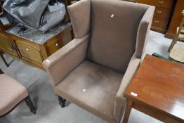 A large 19th century wing-back armchair, of angular design and of generous proportions, seat