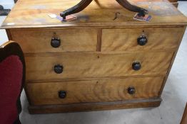 A 19th century satinwood chest of two long and two short drawers, each with turned knob handles,