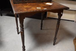 A late Victorian oak parquetry topped occasional table, the moulded square top with geometric design