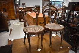 An early 20th century cane seated children's bentwood bistro chair, of traditional design seat