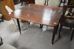 A 19th Century mahogany Pembroke style table having fluted legs