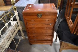 A mo0dern Chinese hardwood canteen chest, having a hinged rectangular top lifting to reveal