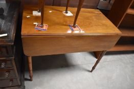 An early 20th century mahogany pembroke table, of rectangular form with rounded oblong flaps, over a