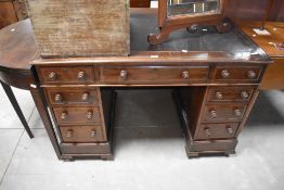 A Victorian mahogany knee hole pedestal desk, the rectangular top with moulded edge detail and