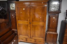 A reproduction yew wood wardrobe, height approx. 191cm, width approx. 130cm