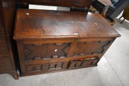 An 18th/19th century oak mule chest, the rectangular top with moulded edge detail opening on iron