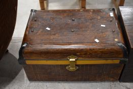 A vintage tin trunk, of traditional form with scumbled or grained decoration 39cm x 61cm x 42cm