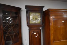 A 19th century oak and mahogany cased and brass dialed 8-day long case clock, by Thomas, Downs of