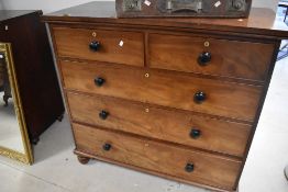 A 19th century mahogany chest of 2/3 cockbeaded drawers, each drawer with turned knob handle and