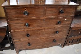 A 19th century mahogany chest of two short and three long drawers, each cockbeaded and with turned