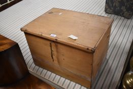 A vintage pine box, of simple hinged rectangular form, with lock and key 37cm x 52cm x 40cm