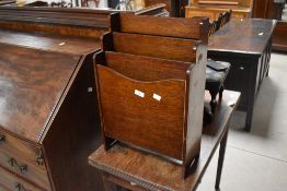 A 1940's oak three division magazine rack,of waterfall type arrangement 54cm x 36cn x 17cm