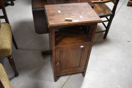 An Arts & Crafts dark oak pot cupboard, height approx. 77cm