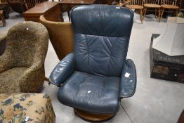 A Stressless green stained leather swivel recliner chair, of typical design, seat height 41cm, 105cm