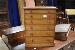 A Victorian pine specimen or collectors chest, the rectangular top above six graduating drawers each