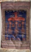 A vintage knotted Afghan prayer rug featuring an eagle and feathers motif, in rich red and navy,