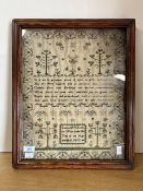 A framed and glazed William IV needlework sampler, performed by Louisa McCleish, aged 8, in 1832,