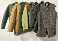 Eight modern quilted ladies jackets and waistcoats, in khaki greens and browns, one floral, to