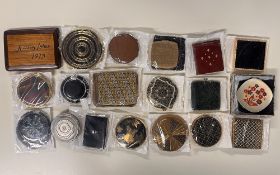 Assorted 20th century vintage makeup compacts and cases, with retro designs such as 60s floral,