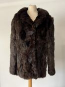 A vintage half length Real Coney fur coat in silky soft brown fur, with wide notch lapels and cool
