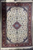A vintage Persian wool rug having red central medallion surrounded by a herati leaf design in blue