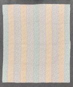 A rare unused 1950s handmade patchwork quilt combining wide stripes of three stunning pastel