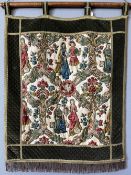 A Belgian style wall hanging with tab top, fringing to the lower hem with a khaki velvet quilted